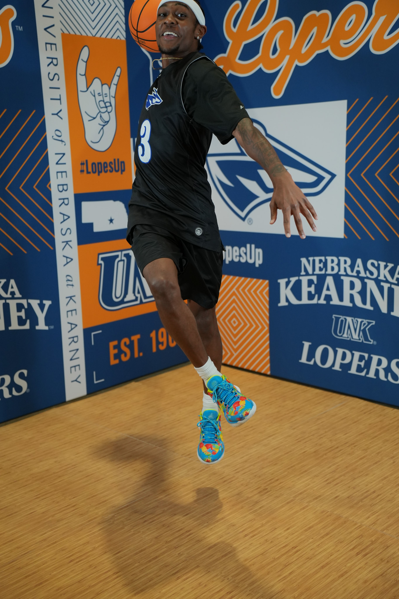 DSC06160 UNK Basketball player Ja'Bryant Hill jumps toward the camera with a basketball.