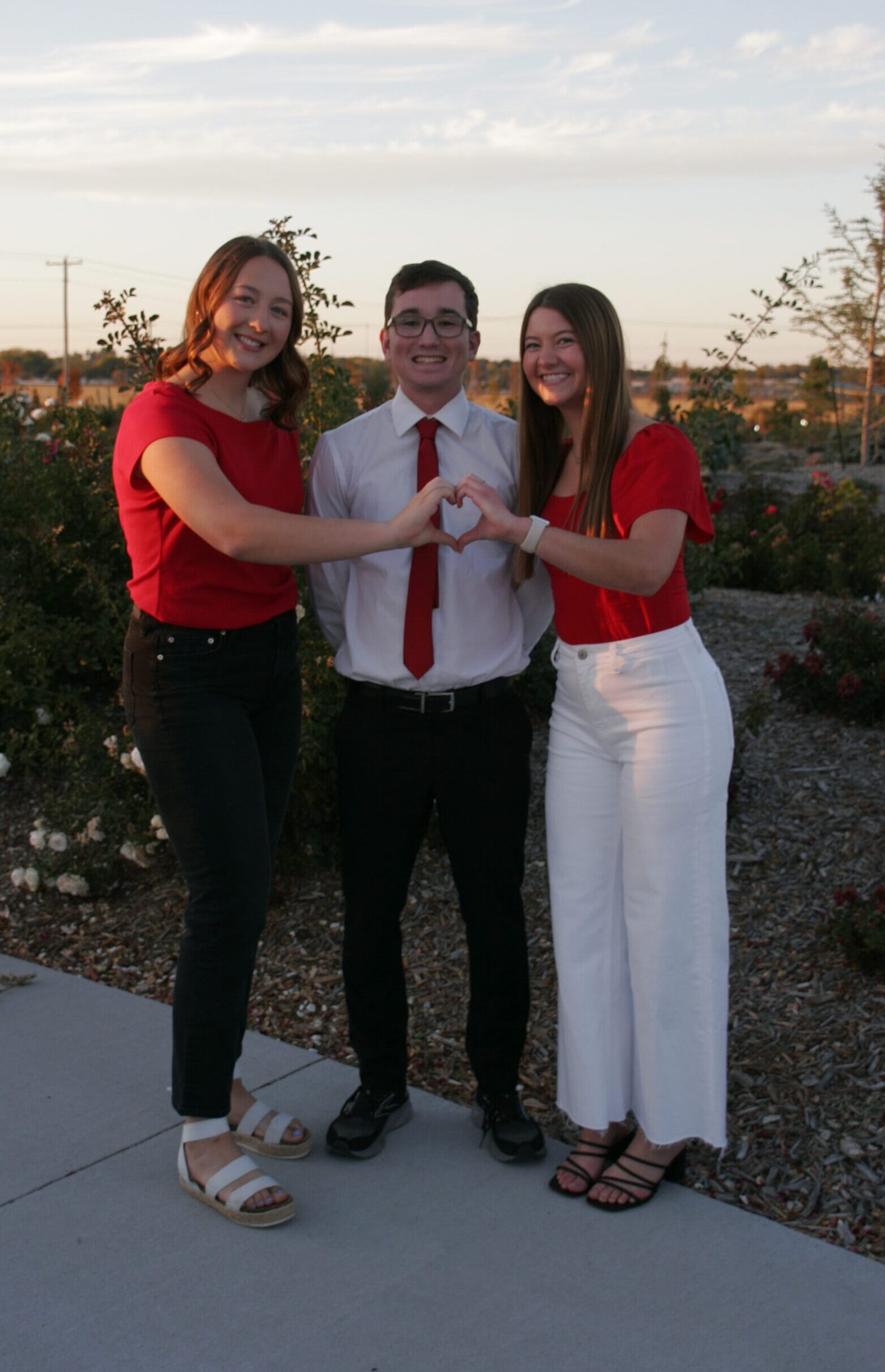 _MG_9330 Meg Schluns and Ryann Sabadka pose with their contestant Carter.