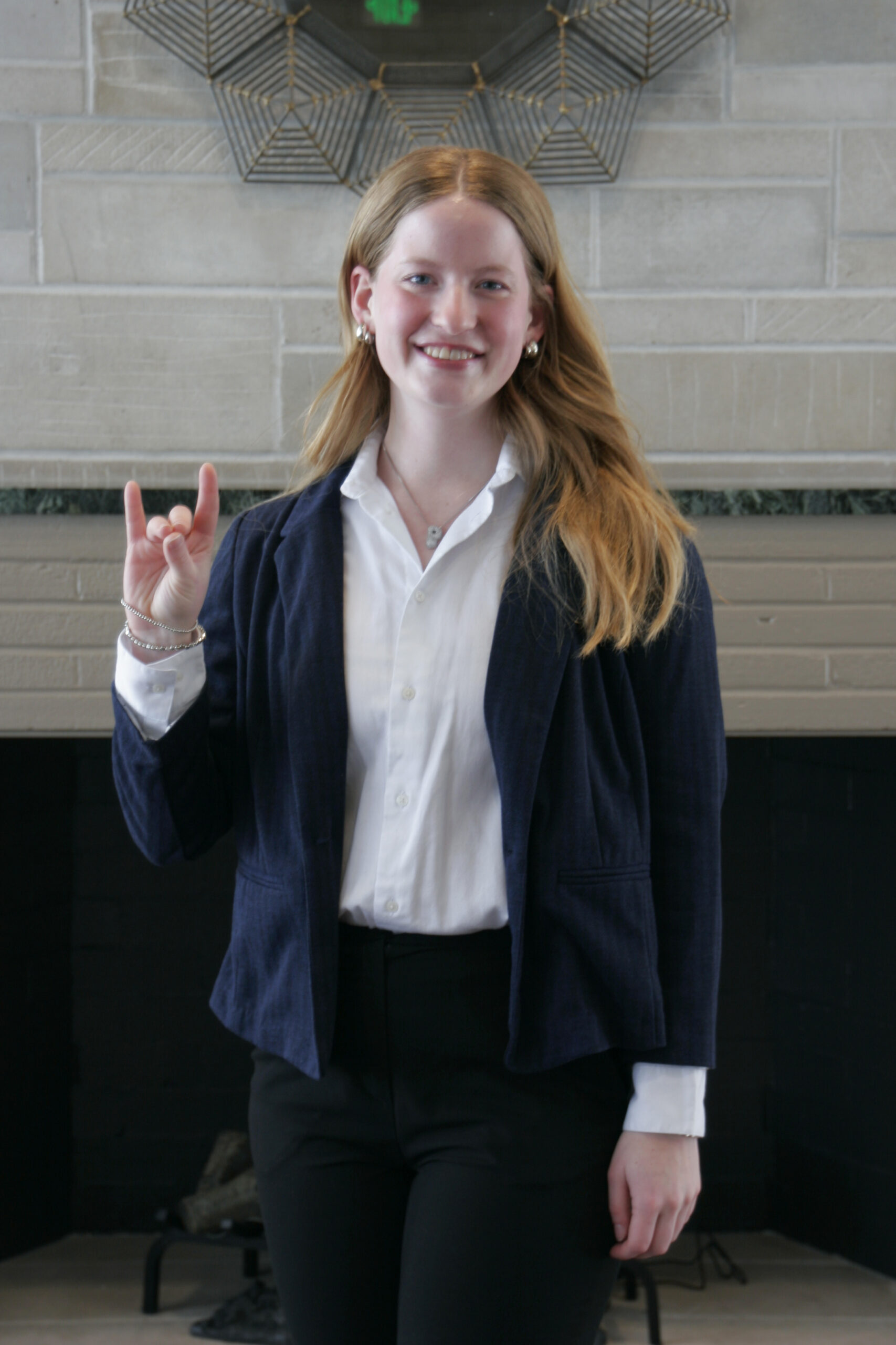 _MG_9579 UNK Vice President Paige Oltmans poses by throwing her Lopes.