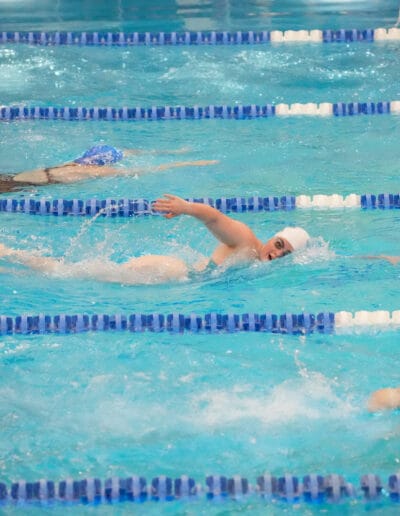 Maggie Wells competes in a swim race at Kearney High school.