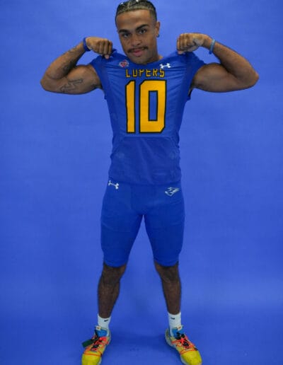 Dylan Jordan poses for a media day photo flexing his muscles.
