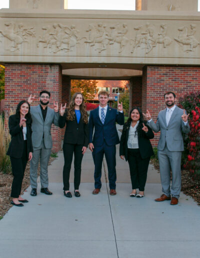 The 2024 Student Government Executive Board poses for a photo in front of the Bell Tower on campus.